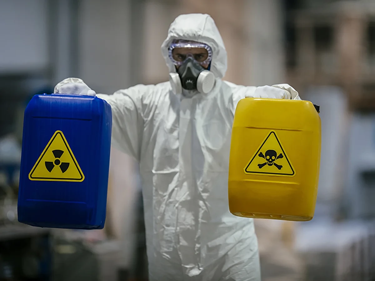Biohazard cleanup technicians in protective equipment at a remediation scene in Madison, TN